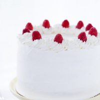 Coconut Raspberry Cake with Whipped Cream Frosting