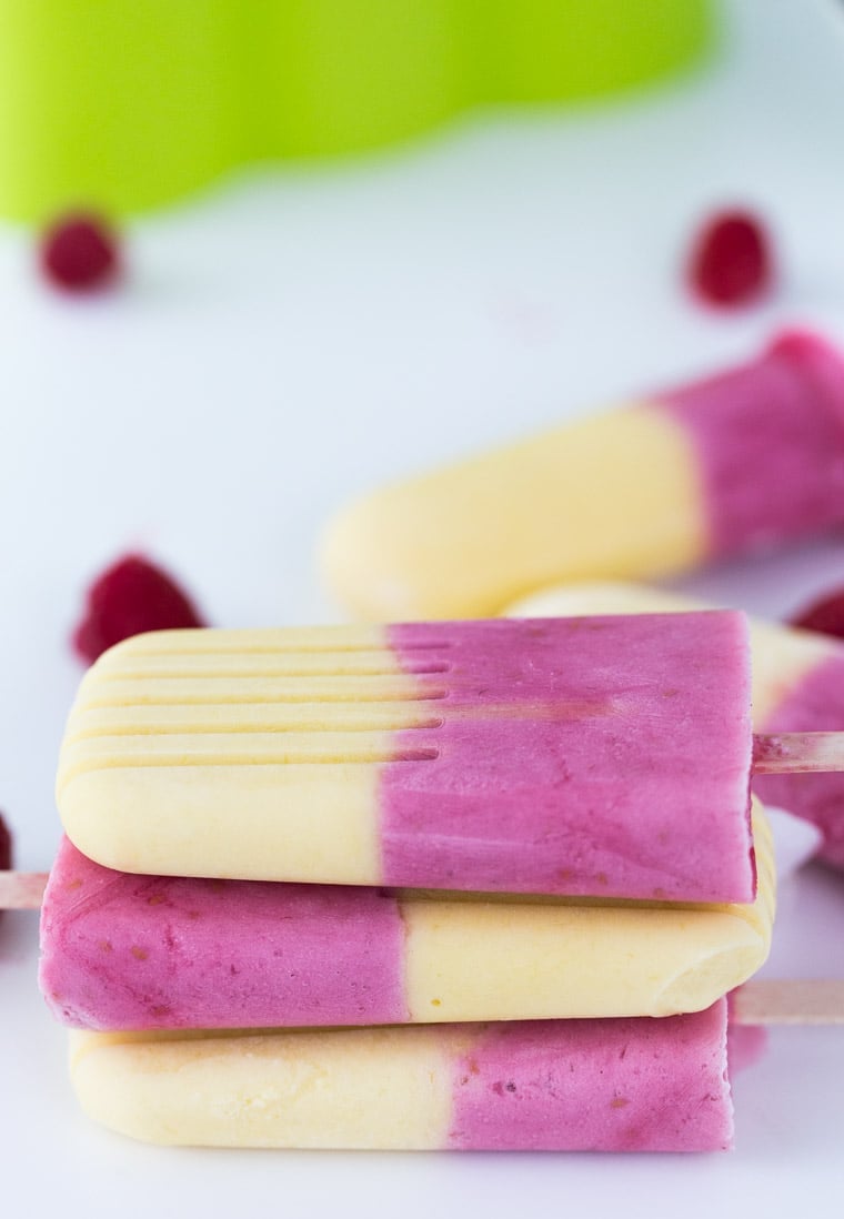 These raspberry mango yogurt pops are naturally sweetened, creamy and delicious!