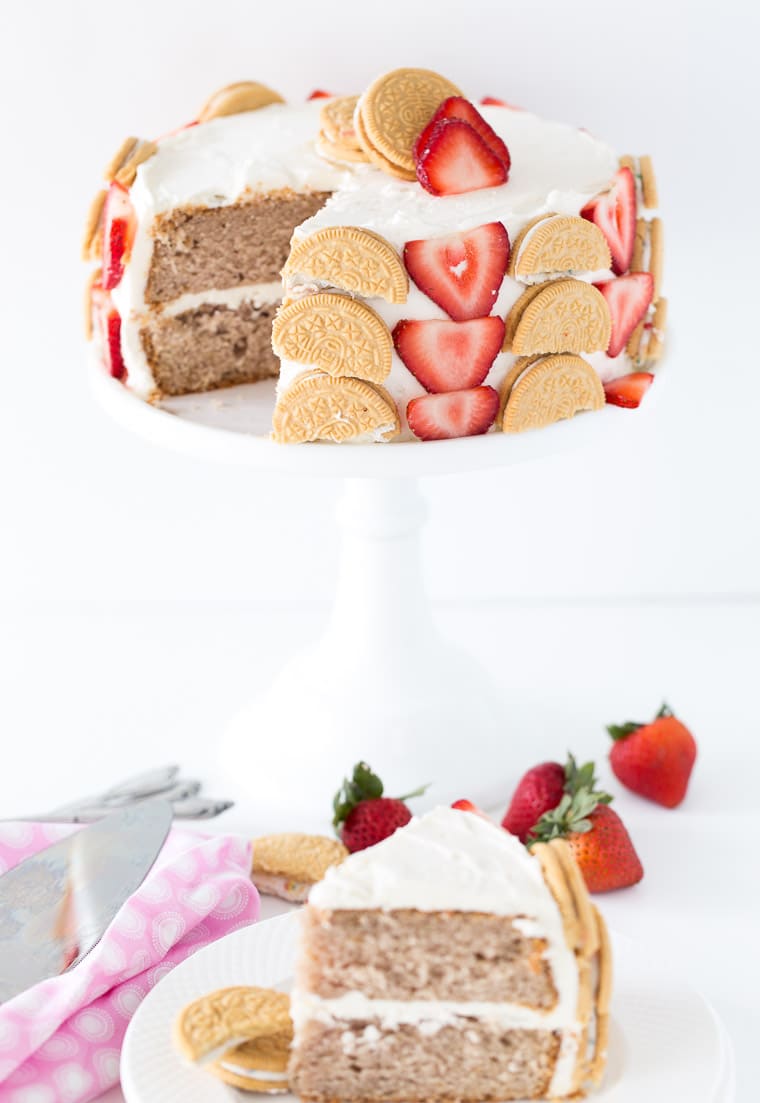 A fun and beautiful strawberry cookie cake decorated with fresh strawberries and birthday cake oreo cookies. Perfect for any birthday! 