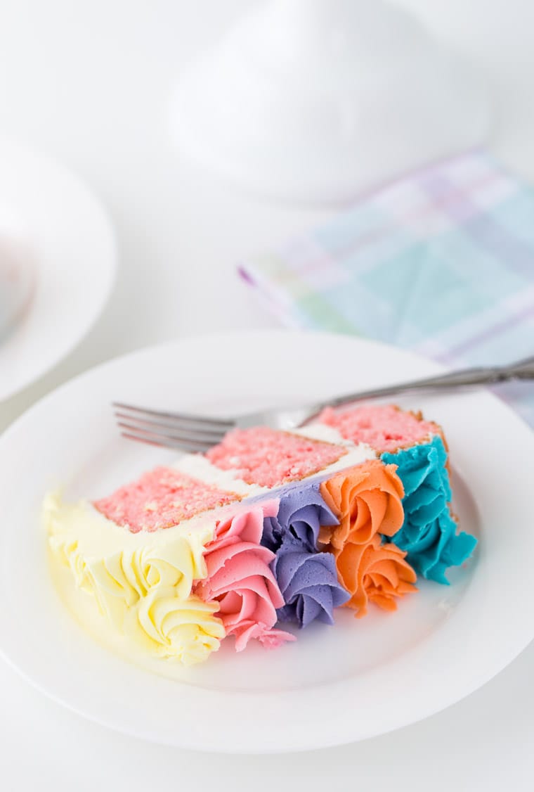 This strawberry rainbow cake is a pretty birthday cake for any girl! With a homemade strawberry cake and whipped vanilla buttercream in colorful swirls