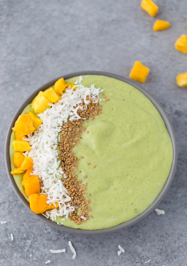 This green mango coconut smoothie bowl is packed with good-for-you ingredients and tropical flavors. 