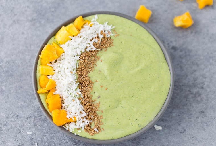 This green mango coconut smoothie bowl is packed with good-for-you ingredients and tropical flavors. 