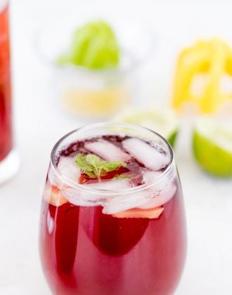 This refreshing Hibiscus Sparkler with hints of ginger and fresh lime juice is easy to whip up and perfect for brunch and summer parties.