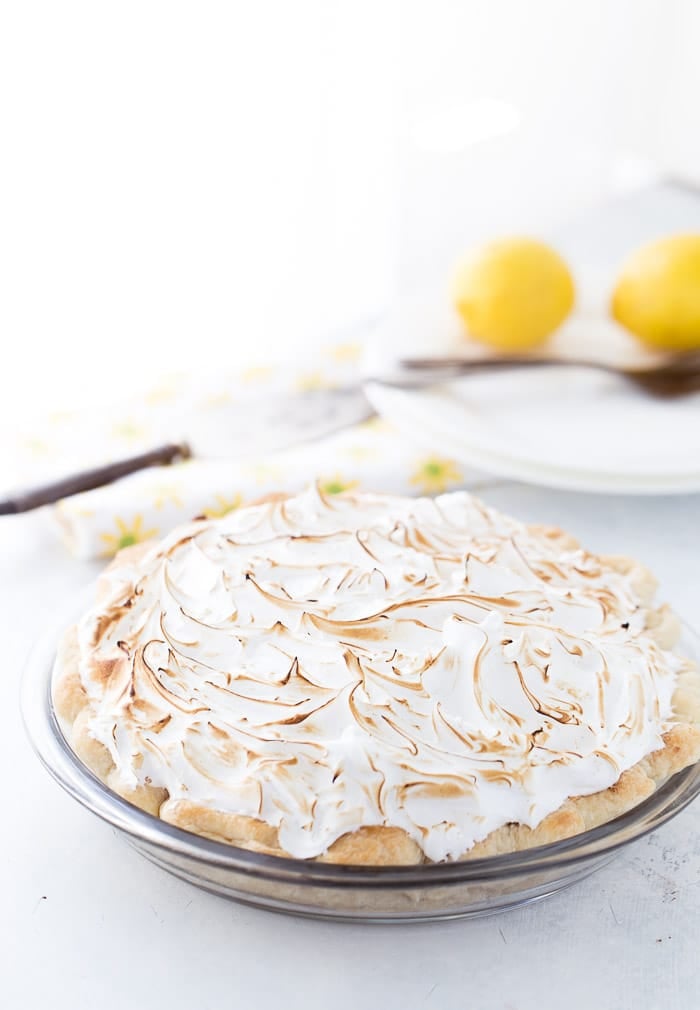 This classic lemon meringue pie is beyond amazing with a flaky pie crust filled with tart lemon custard filling and topped with a toasty meringue cloud.