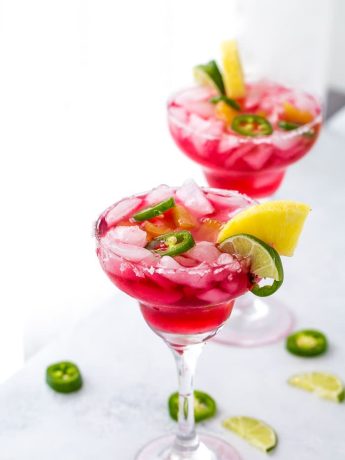 An easy and refreshing Hibiscus Margaritas with sweet pineapple infused syrup and hint of spicy with jalepenos. The perfect mix of sweet and spicy.