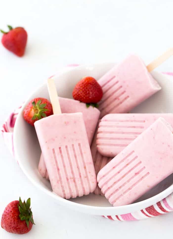  These strawberry coconut cheesecake popsicles are creamy, delicious and refreshing. 