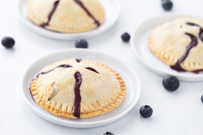 Classic blueberry hand pies with a flaky buttery crust filled with warm juicy blueberry filling and a dollop of cream cheese. It's simply amazing. 