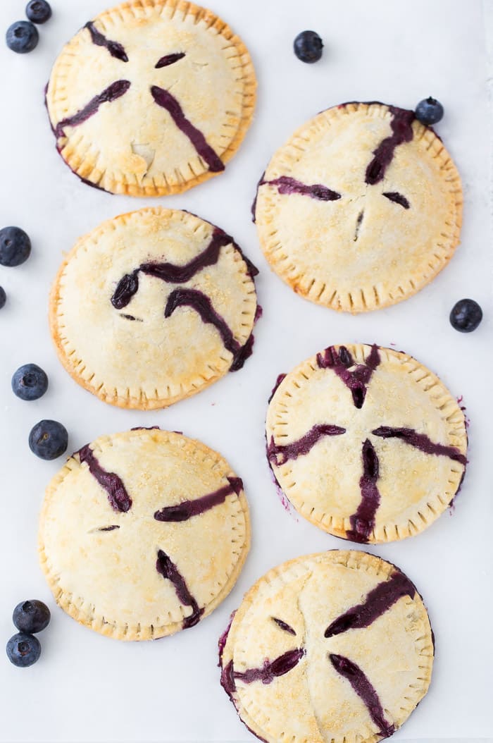 Classic blueberry hand pies with a flaky buttery crust filled with warm juicy blueberry filling and a dollop of cream cheese. It's simply amazing. 