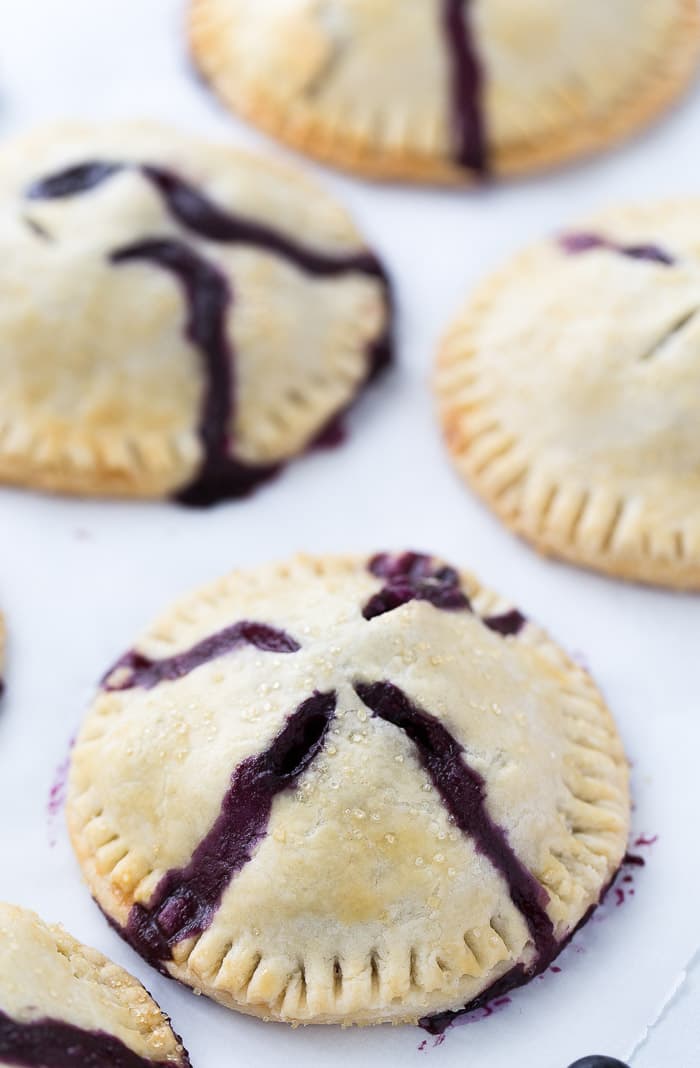 Classic blueberry hand pies with a flaky buttery crust filled with warm juicy blueberry filling and a dollop of cream cheese. It's simply amazing. 