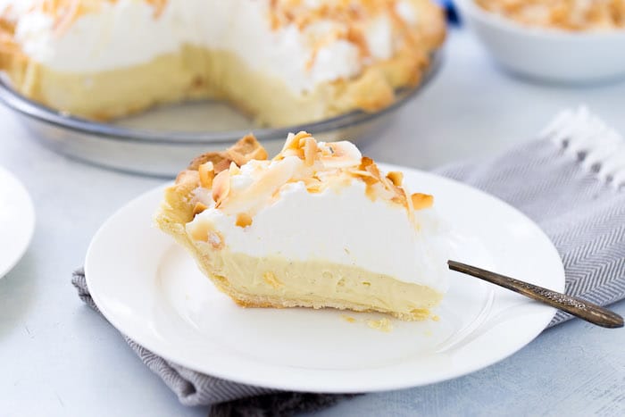 This is your classic coconut cream pie recipe with a sweet silky custard filling rich in coconut flavor. It's the perfect summer pie!