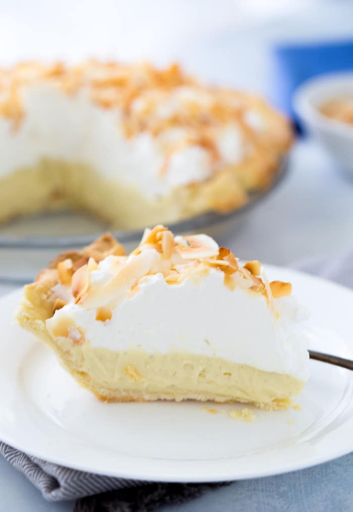 This is your classic coconut cream pie recipe with a sweet silky custard filling rich in coconut flavor. It's the perfect summer pie!