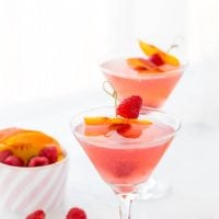 This summer peach raspberry martini recipe is filled with fresh raspberries and juicy peach flavors. A refreshing summer cocktail that's easy to whip up.