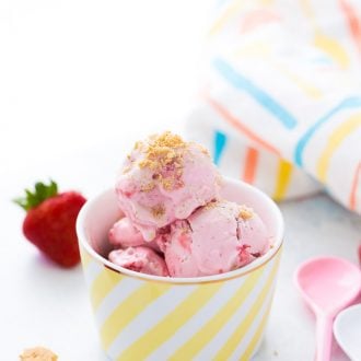This homemade strawberry cheesecake ice cream recipe is creamy delicious, slightly tangy and bursting with sweet strawberries!! Perfect for summer!
