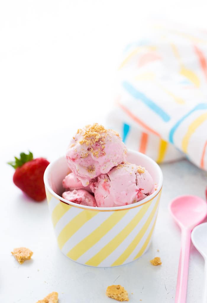 This homemade strawberry cheesecake ice cream recipe is creamy delicious, slightly tangy and bursting with sweet strawberries!! Perfect for summer!