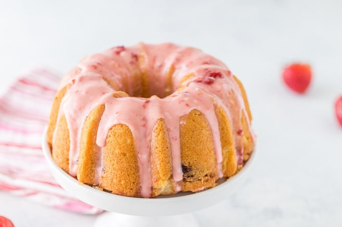 This strawberry lemonade pound cake starts with a luscious lemon pound cake mix infused with strawberries and topped with a fresh strawberry glaze. 