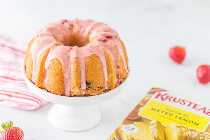 This strawberry lemonade pound cake starts with a luscious lemon pound cake mix infused with strawberries and topped with a fresh strawberry glaze. 