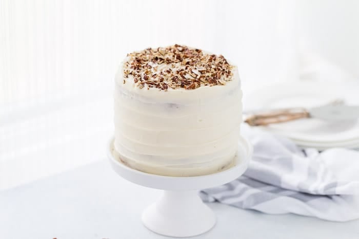 A classic hummingbird cake with a pineapple, banana and pecan spiced cake topped with cream cheese frosting. 