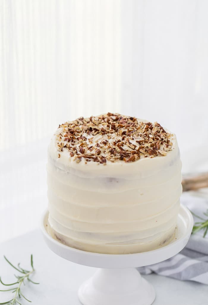 A classic hummingbird cake with a pineapple, banana and pecan spiced cake topped with cream cheese frosting. 