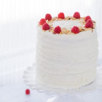 A luscious lemon raspberry cake recipe that is filled with a whipped honey mascarpone filling, raspberry compote and sweet cream cheese frosting.