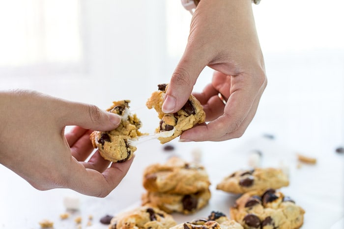 These S'mores Chocolate Chip Cookies are ooey-gooey perfection with a graham cracker cookie base filled with chocolate chips and mini marshmallows.