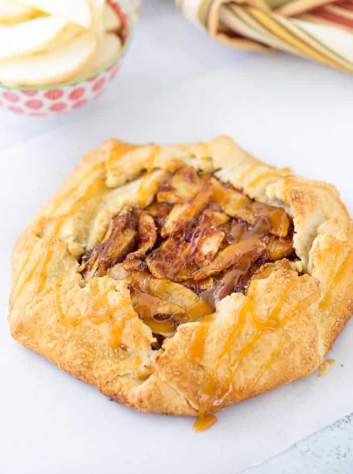 This rustic apple galette with caramel sauce has a spiced apple pie filling baked inside a flaky, buttery crust drizzled with caramel sauce!