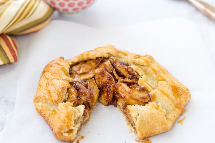 This rustic apple galette with caramel sauce has a spiced apple pie filling baked inside a flaky, buttery crust drizzled with caramel sauce!