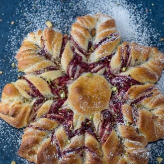This Cranberry Cinnamon Star Bread is a holiday spectacular with a warm cranberry, brie and pistachio filling wrapped around a fluffy bread.