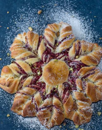 This Cranberry Cinnamon Star Bread is a holiday spectacular with a warm cranberry, brie and pistachio filling wrapped around a fluffy bread.