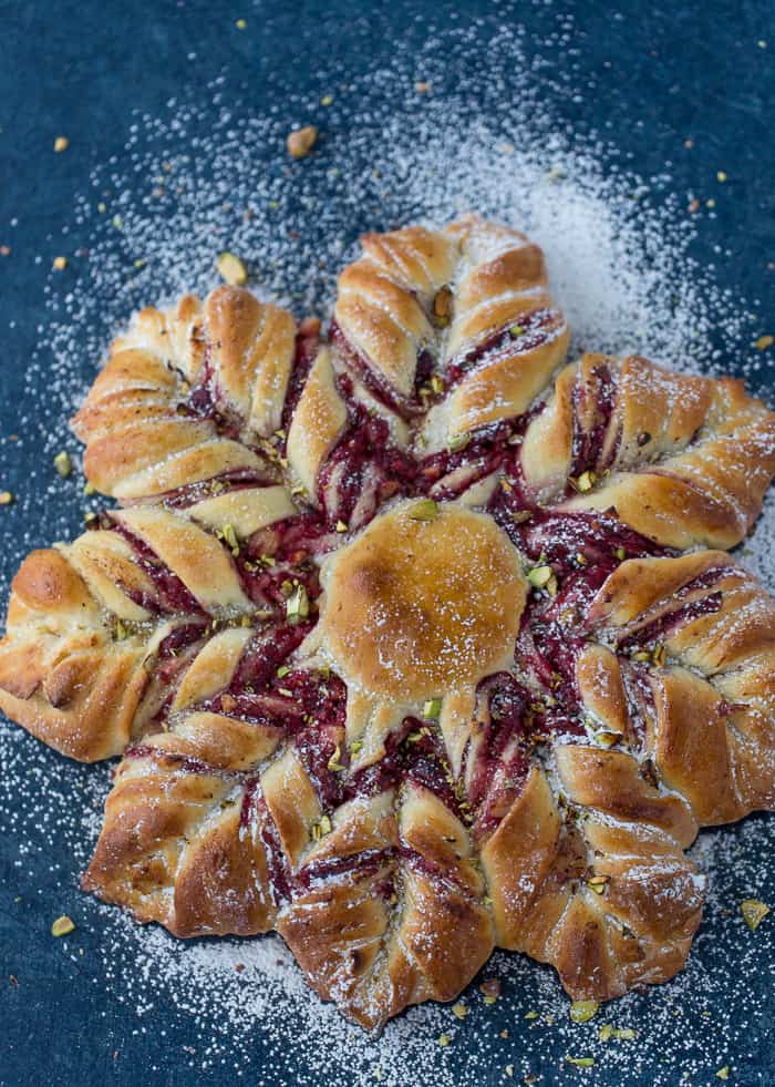This Cranberry Cinnamon Star Bread is a holiday spectacular with a warm cranberry, brie and pistachio filling wrapped around a fluffy bread.