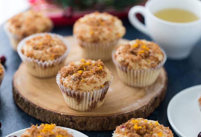 Eggnog Cinnamon Swirl Muffins on a wooden plank.