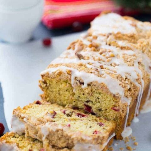 This Cranberry Orange Coffee Cake is a moist crumb cake that will brighten up any cold winter night! Get the quick and easy coffee cake recipe here!