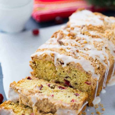 This Cranberry Orange Coffee Cake is a moist crumb cake that will brighten up any cold winter night! Get the quick and easy coffee cake recipe here!