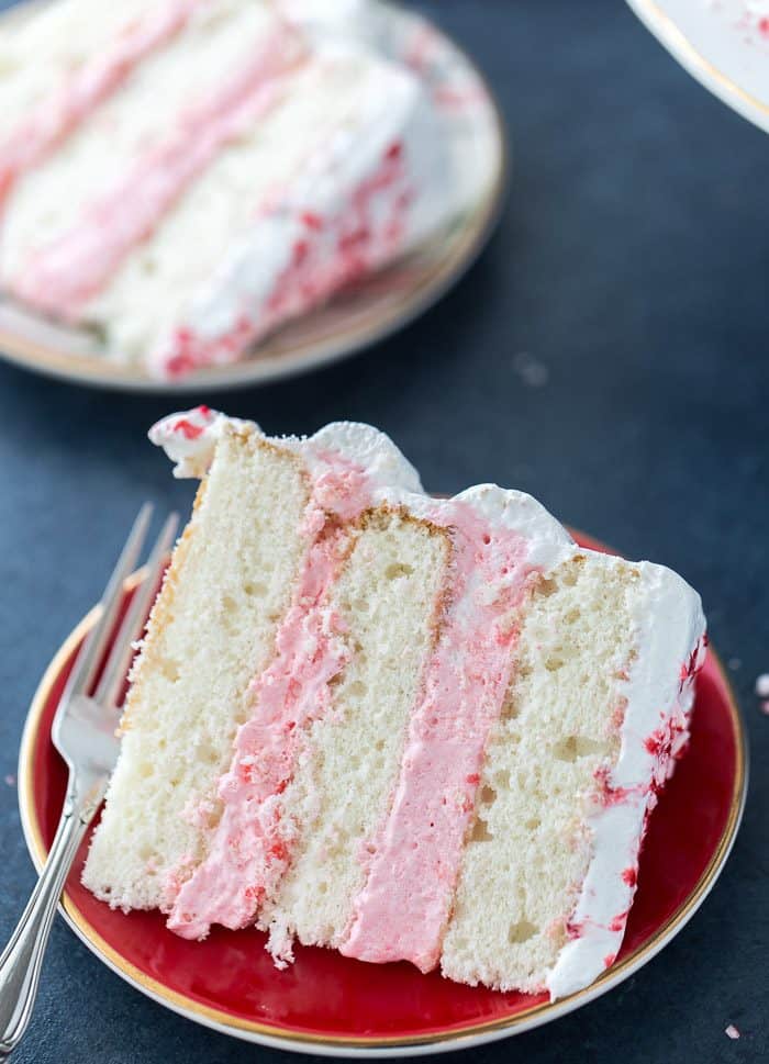 This peppermint layered cake is a holiday special with an airy, light peppermint crunch cake with a sweet peppermint cloud frosting. It's winter perfection.