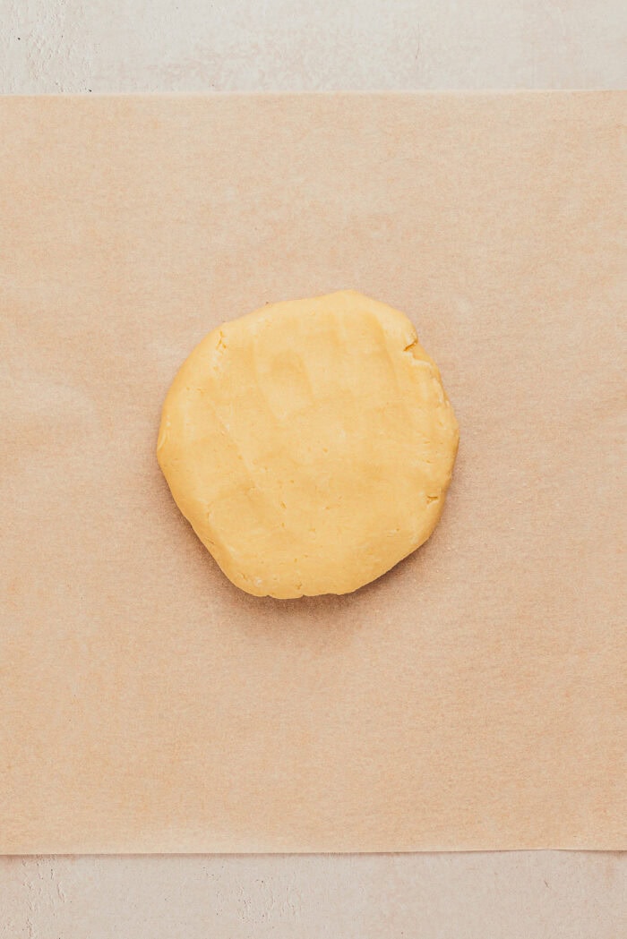 The tart dough rolled into a disk.