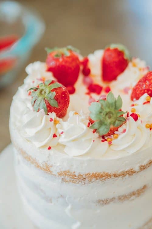strawberry naked cake with rose buttercream