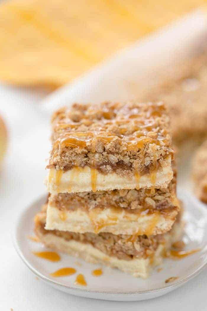 A triple layer of apples, cheesecake and crumb coat make these apple crumble cheesecake bars a different take on a classic fall dessert.