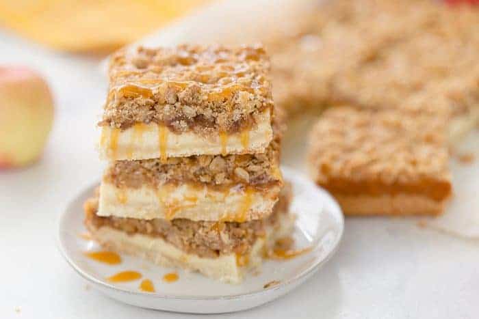 A triple layer of apples, cheesecake and crumb coat make these apple crumble cheesecake bars a different take on a classic fall dessert.