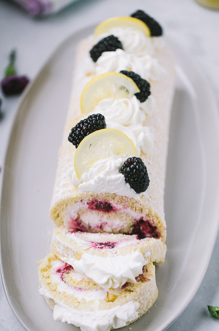 Tasty blueberry swiss roulade as spring cake. Stock Photo by Shaiith