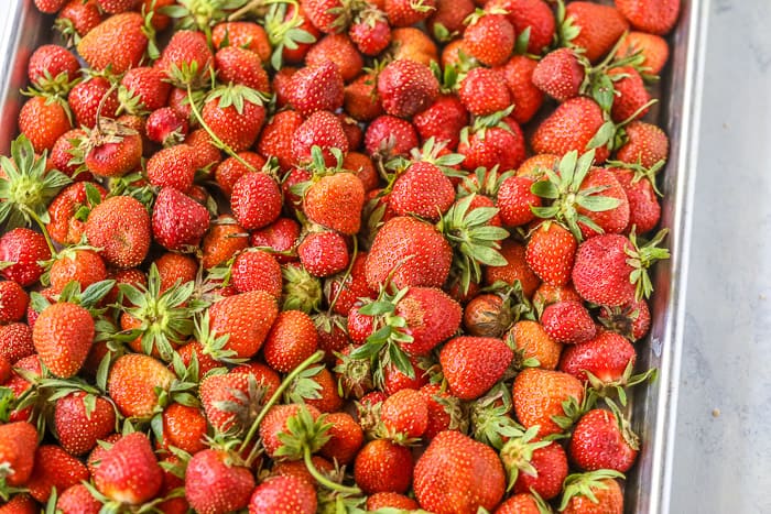 A tray of fresh strawberries.