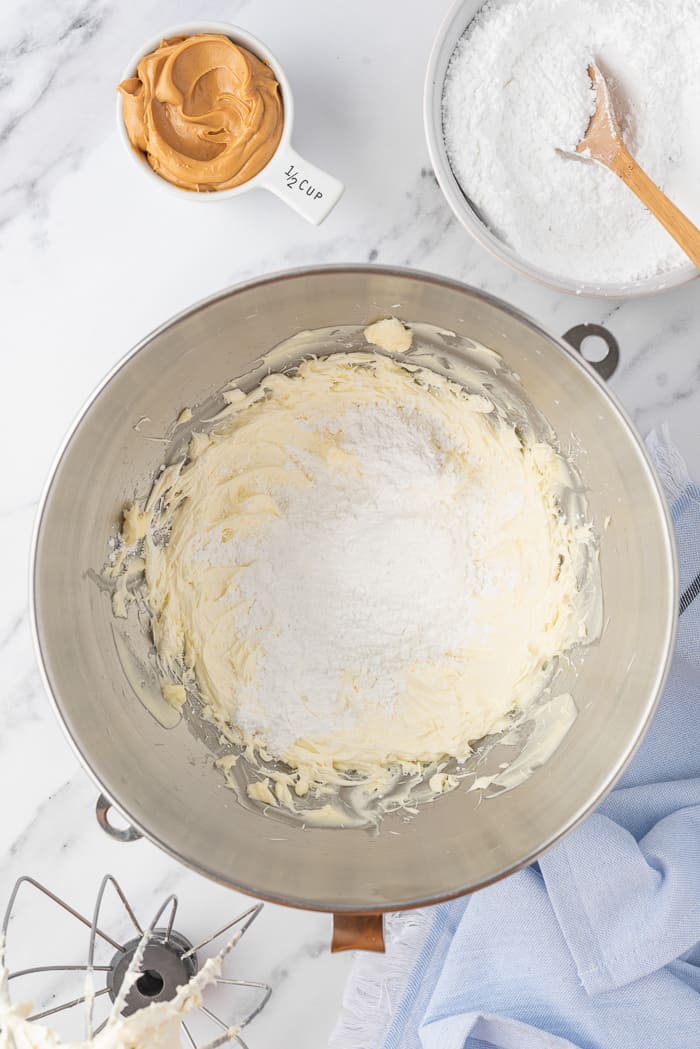 Peanut Butter Buttercream being mixed in a bowl.