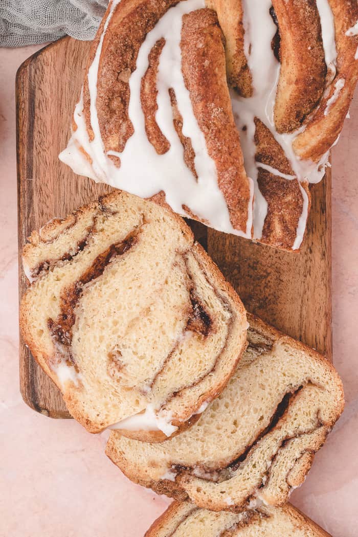 Cinnamon Swirl Bread sliced on a cutting board. 