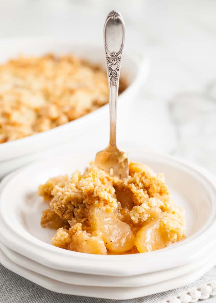 Easy Apple Cobbler on a plate with a fork in it. 