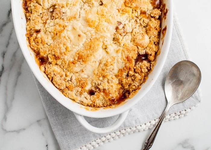 Easy Apple Cobbler Recipe view of the cobbler topping in a casserole dish.