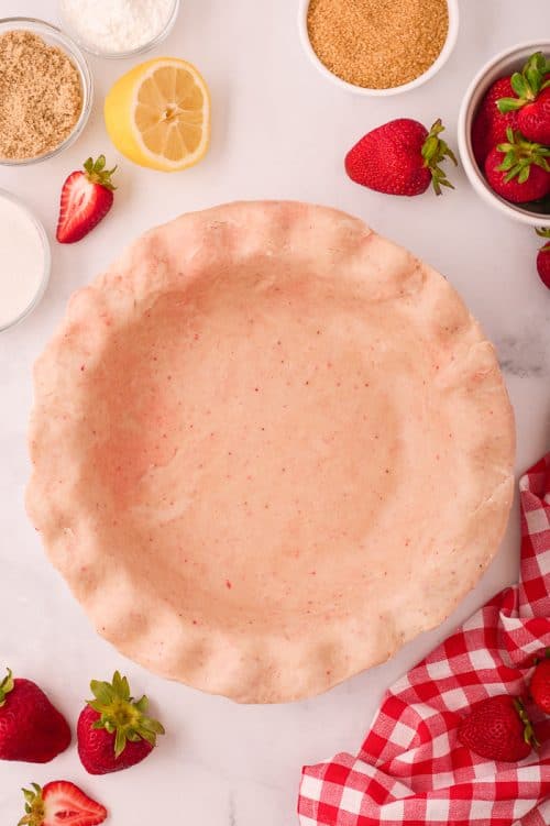 Homemade Strawberry Pie crust in a pie plate.