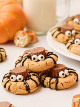 Spider peanut butter cookies stacked on top of each other.
