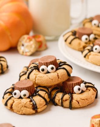 Spider peanut butter cookies stacked on top of each other.