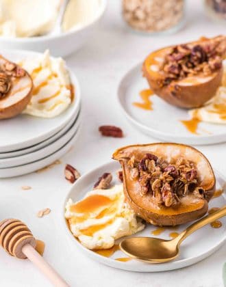 Baked pears on a plate with mascarpone cheese