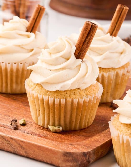 Chai cupcakes on a cutting board.