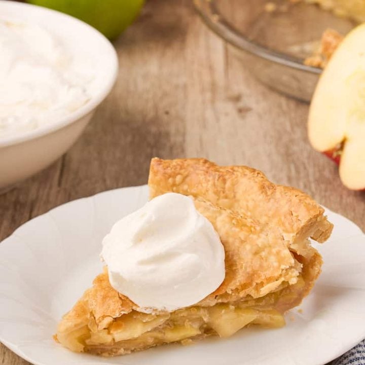 A slice of maple cream apple pie on a plate.