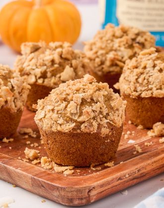 Pumpkin muffins on a cutting board.